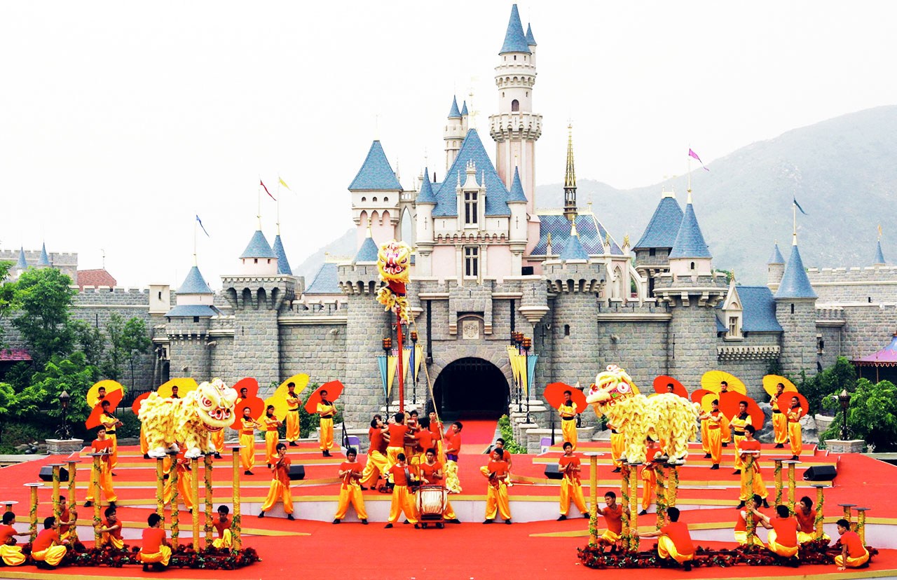 HONG KONG, CHINA: A traditional dragon is performed during the opening ceremony of Hong Kong Disneyland theme park, 12 September 2005. Disney officially opened its newest theme park in Hong Kong by Chinese Vice President Zeng Qinghong, marking its first step into the lucrative China market. AFP PHOTO/TED ALJIBE (Photo credit should read TED ALJIBE/AFP/Getty Images)